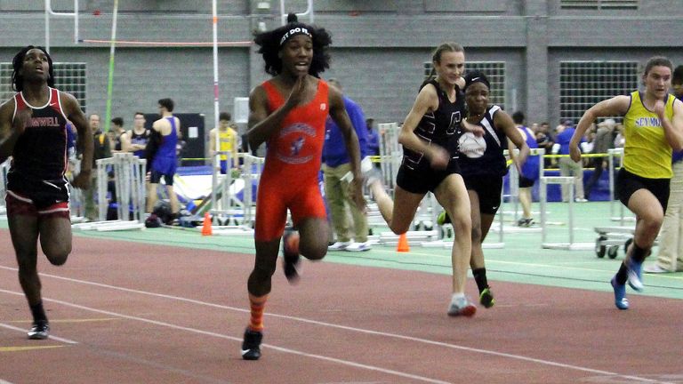 In this Feb. 7, 2019 photo, Bloomfield High School transgender athlete Terry Miller, second from left, wins the final of the 55-meter dash over transgender athlete Andraya Yearwood, far left, and other runners in the Connecticut girls Class S indoor track meet at Hillhouse High School in New Haven, Conn. 