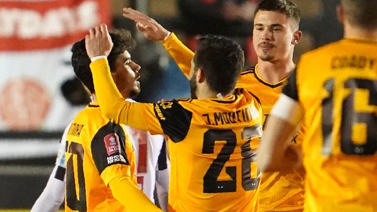 Vitinha is congratulated by team-mates after putting Wolves ahead at Chorley  - AP Photo