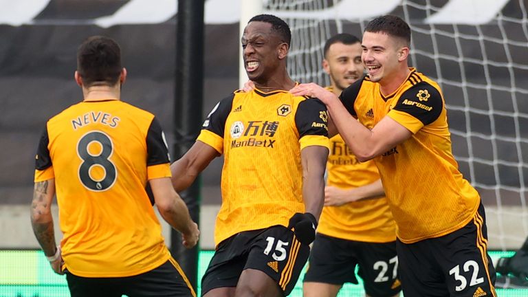 Willy Boly celebrates with his Wolves team-mates during their 3-2 home defeat