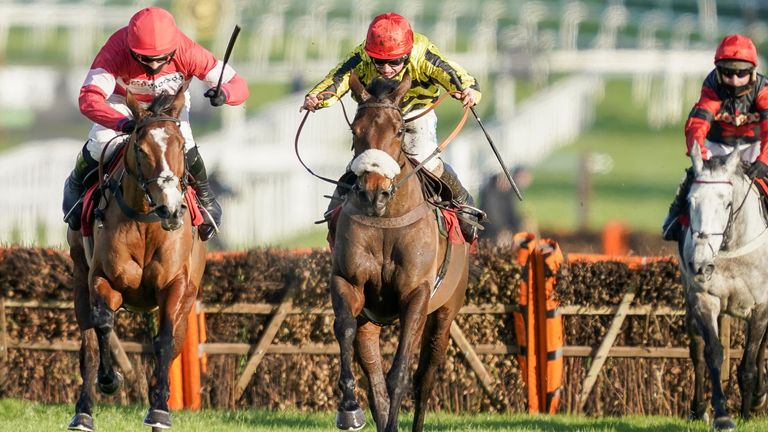 Whitehotchillifili ridden by Sean Bowen (centre, yellow) clear the last to win The Unibet 'You're On' Mares' Hurdle from Stormy Ireland ridden by Harry Cobden (left, red) at Sandown Park Racecourse on January 02, 2021 in Esher, England. Due to the Coronavirus pandemic, owners along with the paying public will not be allowed to attend the meeting. (Photo by Alan Crowhurst/Getty Images).