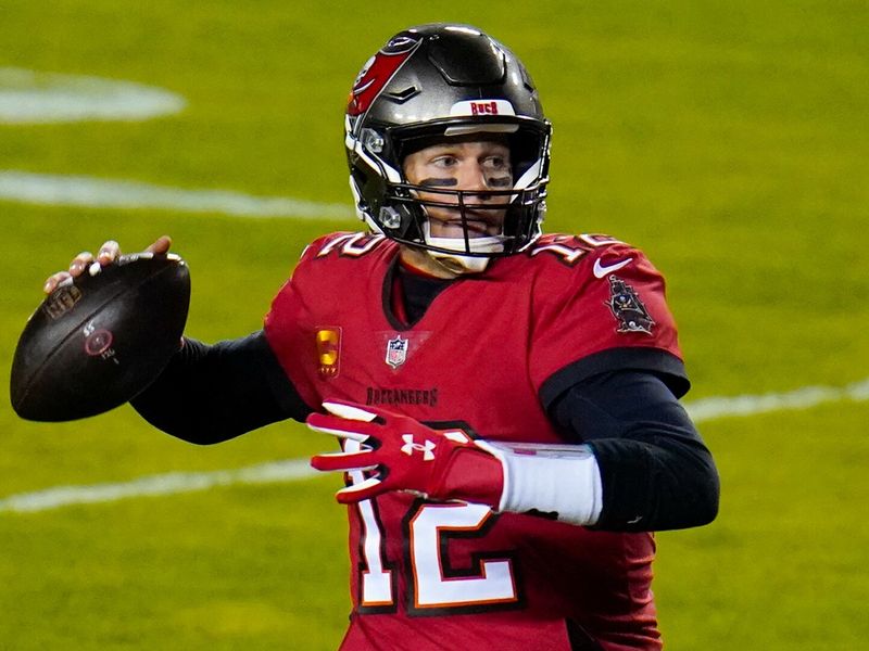 Tom Brady and the Buccaneers hold off Washington, 31-23, to advance in the  playoffs