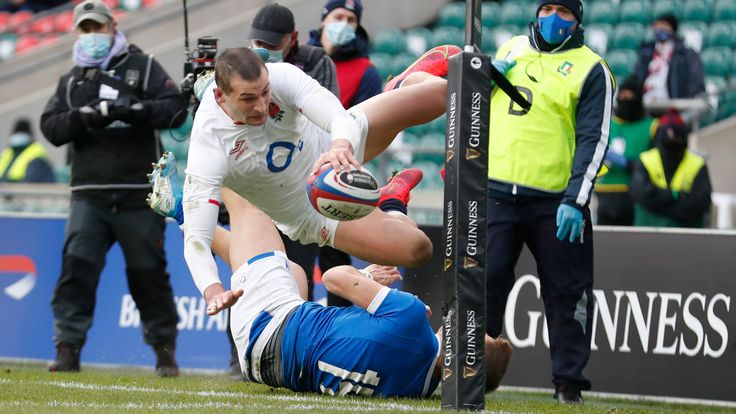 England's Jonny May scores a try during the Six Nations rugby union international match between England and Italy at Twickenham Stadium in London, Saturday, Feb. 13, 2021. (AP Photo/Alastair Grant)..