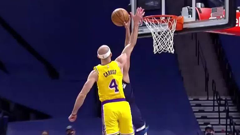 Alex Caruso blocks for the La Lakers against the Minnesota Timberwolves