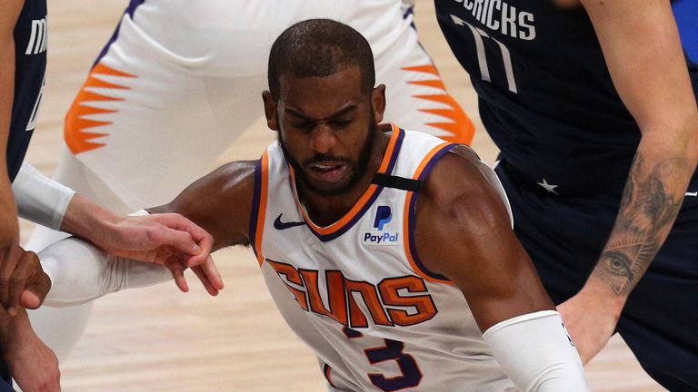 Dallas Mavericks guard Luka Doncic (77) has the ball tipped away by Phoenix Suns guard Chris Paul (3) in the second half during an NBA basketball game, Monday, Feb. 1, 2021, in Dallas. 