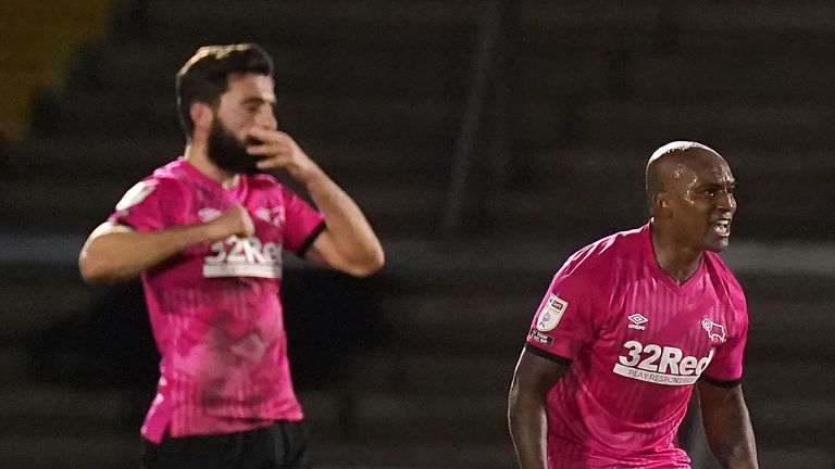 Andre Wisdom (R) celebrates scoring the late winner for Derby