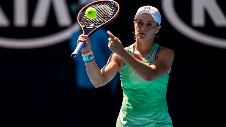 Ashleigh Barty of Australia pass the ball over the net for the next match to proceed during the semifinals of the 2020 Australian Open on January 30 2020, at Melbourne Park in Melbourne, Australia. (Photo by Jason Heidrich/Icon Sportswire) (Icon Sportswire via AP Images)