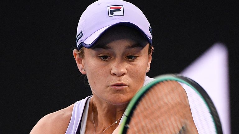 Australia's Ashleigh Barty hits a backhand return to United States' Shelby Rogers during their fourth round match at the Australian Open tennis championship in Melbourne, Australia, Monday, Feb. 15, 2021.(AP Photo/Andy Brownbill)