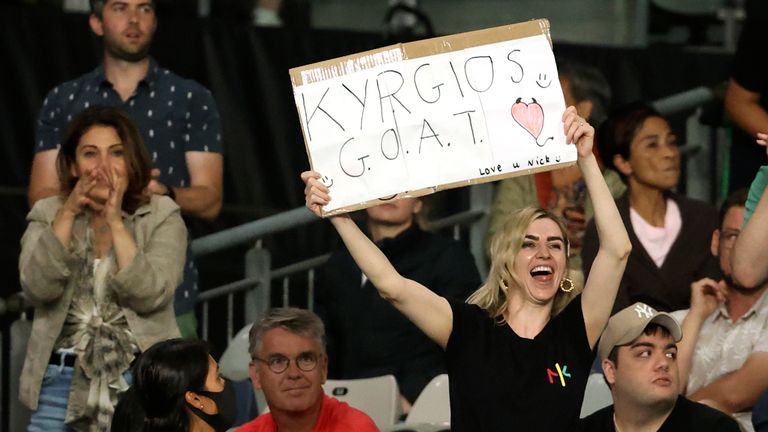 A fans holds a placard in support of Australia's Nick Kyrgios