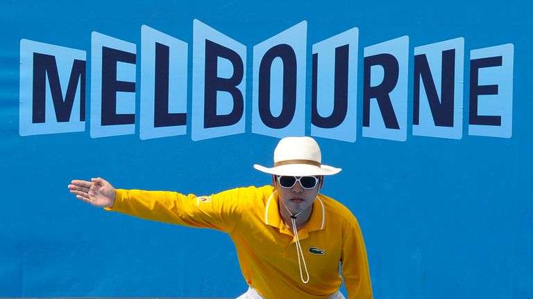 A linesman gestures that a ball is out during a third round match between Spain's Nicolas Almagro and Croatia's Ivan Ljubicic at the Australian Open tennis championships in Melbourne, Australia.