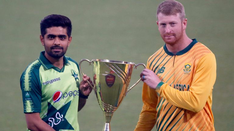 Pakistan...s Twenty20 team...s skipper Babar Azam, left, and his South Africa...s counterpart Heinrich Klaasen, pose for photographer with trophy of Twenty20 series at the Gaddafi Stadium, in Lahore, Pakistan, Wednesday, Feb. 10, 2021. Pakistan and South Africa will play three Twenty20 match series, starting from Feb. 11. (AP Photo/K.M. Chaudary)