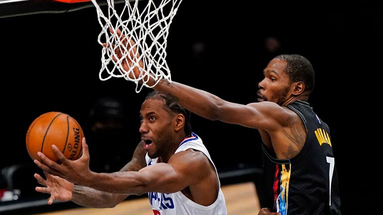 AP - Brooklyn Nets forward Kevin Durant (7) defends against Los Angeles Clippers forward Kawhi Leonard (2)