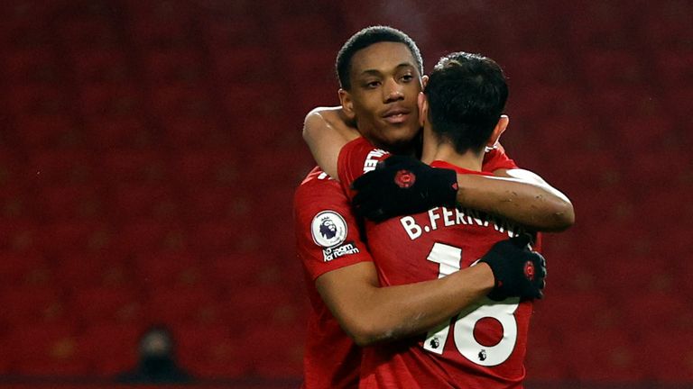 Bruno Fernandes celebrates with Anthony Marital after scoring Man Utd's seventh goal from the penalty spot (AP)