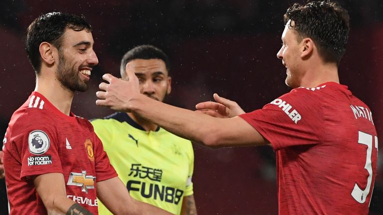 Bruno Fernandes celebrates with Nemanja Matic after putting Manchester United 3-1 up against Newcastle