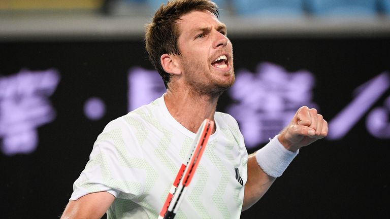 Britain's Cameron Norrie celebrates after winning his second round match against Russia's Roman Safiullin at the Australian Open tennis championship in Melbourne, Australia, Thursday, Feb. 11, 2021.(AP Photo/Andy Brownbill)