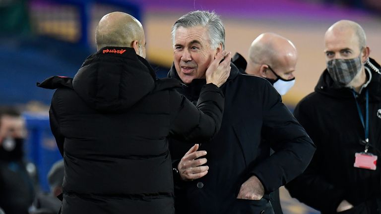 Carlo Ancelotti is greeted by Pep Guardiola prior to kick-off at Goodison