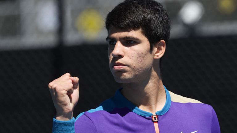 Spain's Carlos Alcaraz celebrates a point win over Botic Van de Zandschulp of the Netherlands during their first round match at the Australian Open tennis championship in Melbourne, Australia, Tuesday, Feb. 9, 2021.(AP Photo/Hamish Blair)