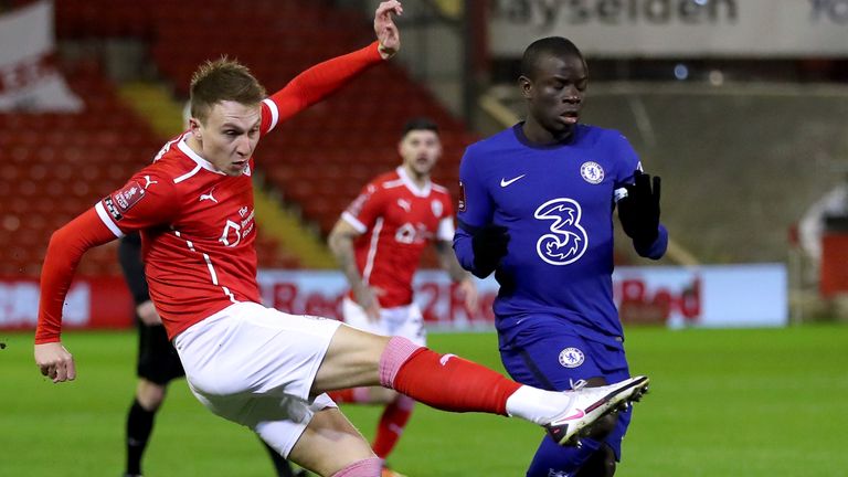 Barnsley's Cauley Woodrow has a shot on goal against Chelsea