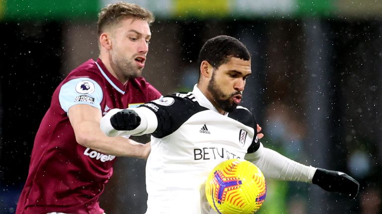 Burnley's Charlie Taylor and Fulham's Ruben Loftus-Cheek battle for the ball