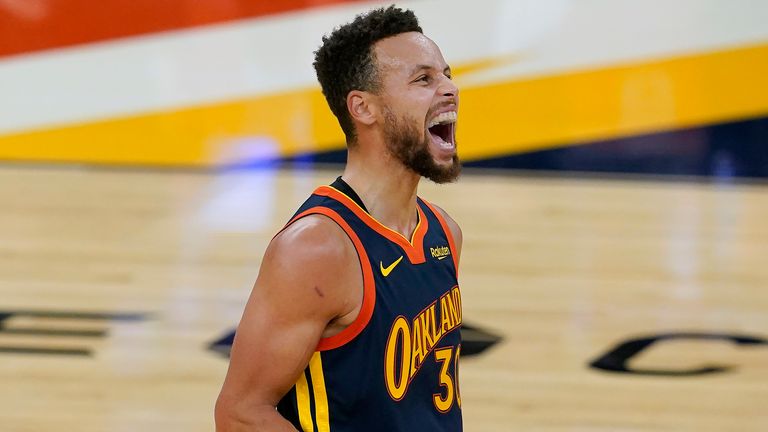 Golden State Warriors guard Stephen Curry reacts during the first half of the team's NBA basketball game against the Boston Celtics in San Francisco, Tuesday, Feb. 2, 2021.