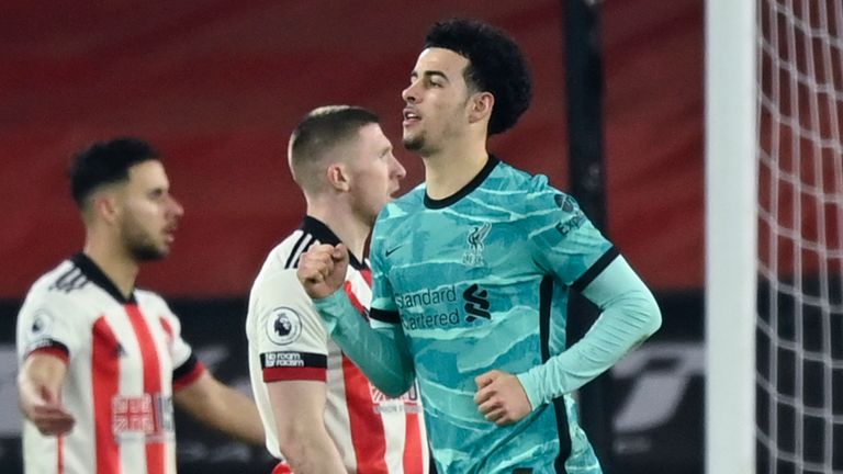 Liverpool&#39;s Curtis Jones, in green, celebrates scoring his side&#39;s first goal during the English Premier League soccer match between Sheffield United and Liverpool at Bramall Lane stadium in Sheffield, England, Sunday, Feb. 28, 2021. (Shaun Botterill, Pool via AP)


