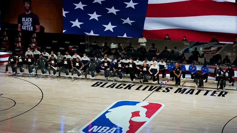 Dallas Mavericks kneel in to pay tribute to the Black Lives Matter movement