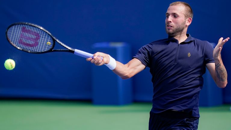 Dan Evans, of the United Kingdom, returns to Andrey Rublev, of Russia, at the Western & Southern Open tennis tournament, Sunday, Aug. 23, 2020, in New York. (AP Photo/Frank Franklin II)