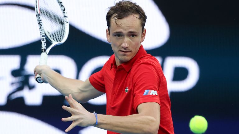 Russia's Daniil Medvedev makes a forehand return to Argentina's Diego Schwartzman during their ATP Cup match in Melbourne, Australia, Tuesday, Feb. 2, 2021. (AP Photo/Hamish Blair)