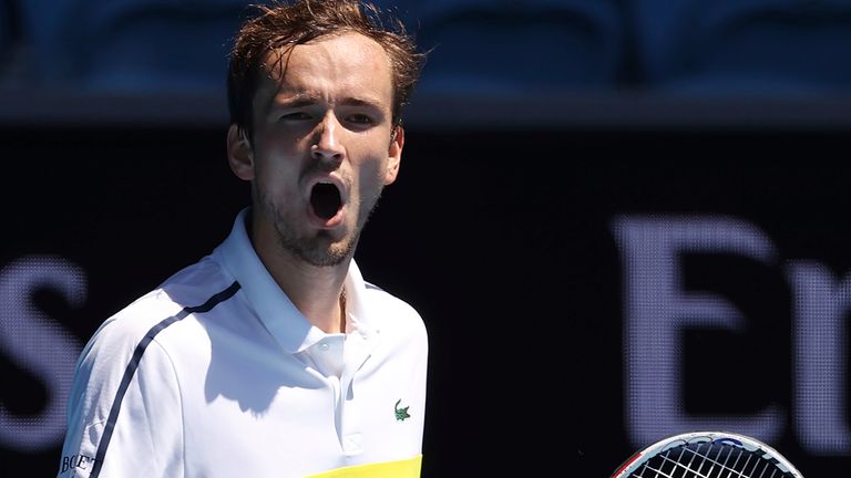 Russia's Daniil Medvedev celebrates breaking the serve from United States' Mackenzie McDonald during their fourth round match at the Australian Open tennis championships in Melbourne, Australia, Monday, Feb. 15, 2021. (AP Photo/Hamish Blair)