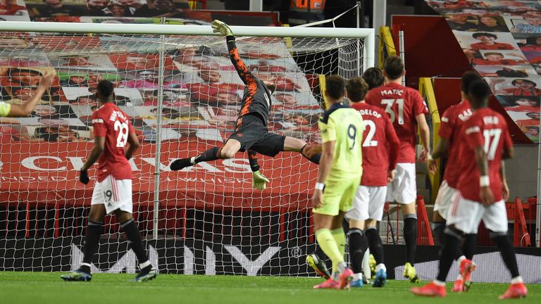 David de Gea dives at full stretch to deny Joelinton in the opening period