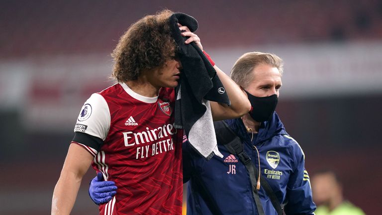 Arsenal's David Luiz receives treatment after a clash of heads with Wolverhampton Wanderers' Raul Jimenez (not pictured) during the Premier League match at the Emirates Stadium