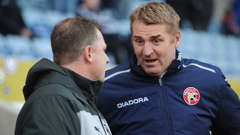 Coventry City manager Mark Robins (left) talks to Walsall manager Dean Smith