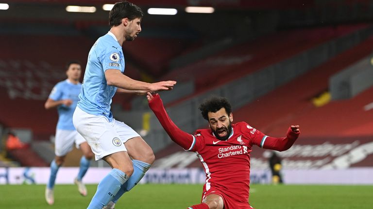 Ruben Dias was penalised for tugging Mohamed Salah's arm as Liverpool were awarded a penalty against Manchester City