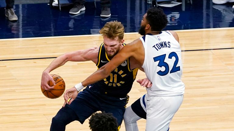 AP - Indiana Pacers&#39; Domantas Sabonis (11) tries to drive around Minnesota Timberwolves&#39; Karl-Anthony Towns 