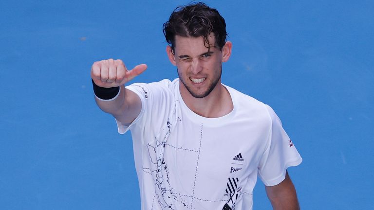 Austria's Dominic Thiem celebrates after defeating Germany's Dominik Koepfer in their second round match at the Australian Open tennis championship in Melbourne, Australia, Wednesday, Feb. 10, 2021.(AP Photo/Rick Rycroft)