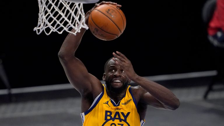 Draymond Green gets up for the dunk