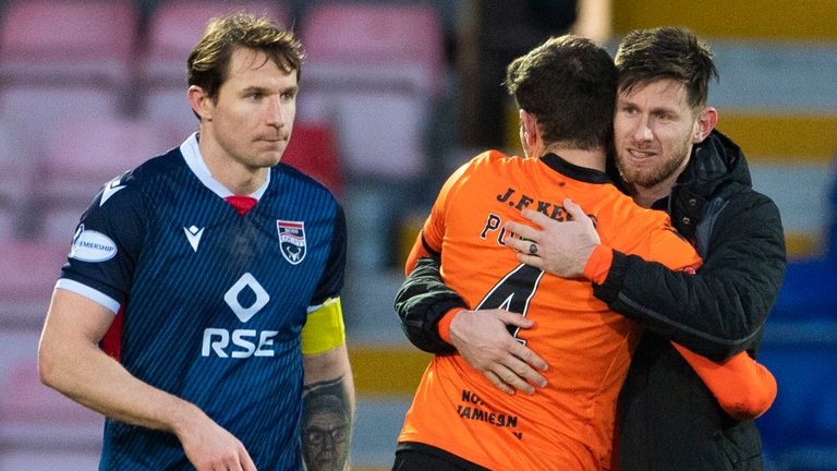 Dundee United's Dillon Powers and Calum Butcher celebrate the win, while Ross County's Callum Morris looks frustrated