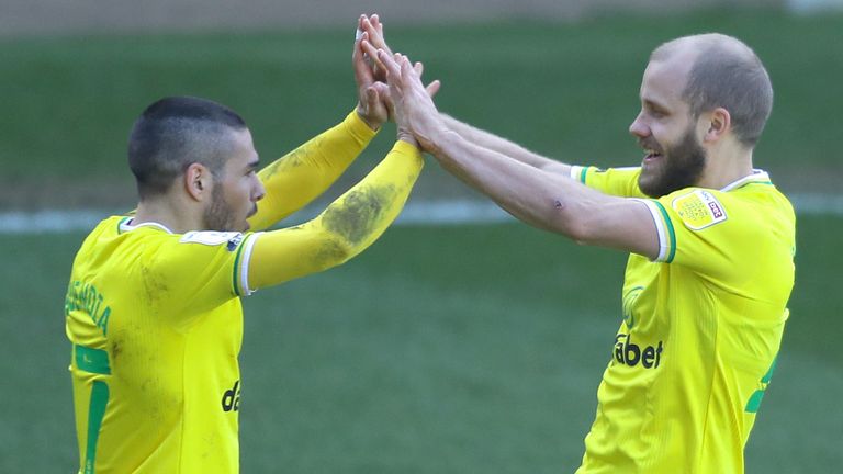 Teemu Pukki celebrates his goal with Emiliano Buendia