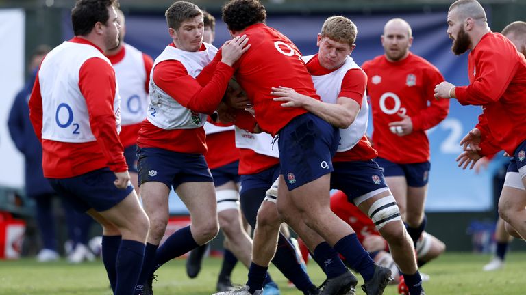 England players must dine at separate tables but get stuck in during training