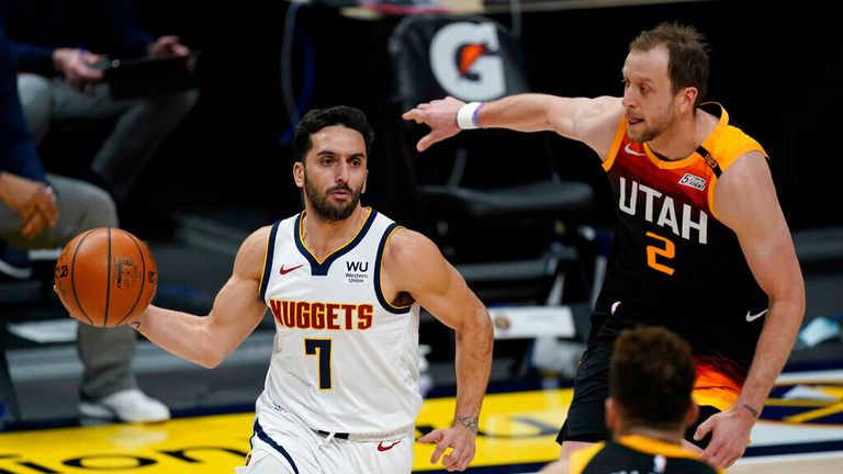 AP - Denver Nuggets guard Facundo Campazzo, left, drives to the basket