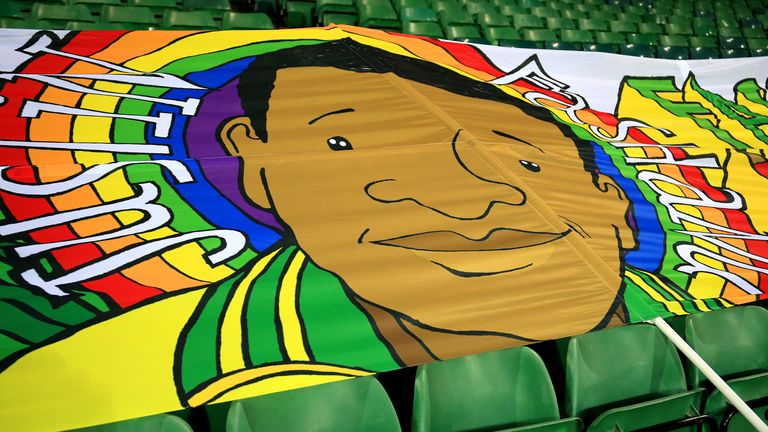 NORWICH, ENGLAND - DECEMBER 09: A banner of former footballer Justin Fashanu is seen inside the stadium ahead of the Sky Bet Championship match between Norwich City and Nottingham Forest at Carrow Road on December 09, 2020 in Norwich, England. A limited number of spectators (2000) are welcomed back to stadiums to watch elite football across England. This was following easing of restrictions on spectators in tiers one and two areas only. (Photo by Stephen Pond/Getty Images)
