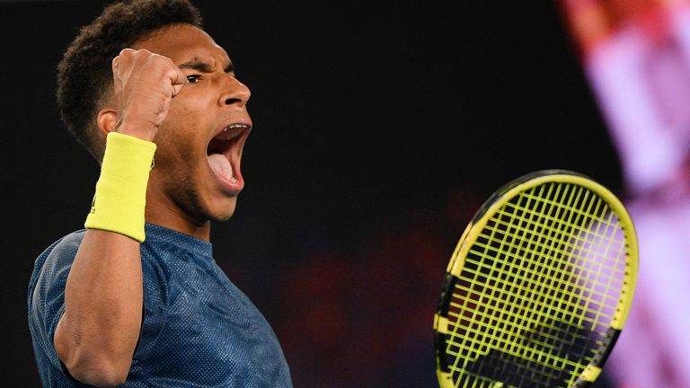 Canada's Felix Auger-Aliassime celebrates after defeating compatriot Denis Shapovalov in their third round match at the Australian Open tennis championship in Melbourne, Australia, Friday, Feb. 12, 2021.(AP Photo/Andy Brownbill)