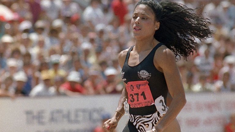 Athlete Florence Griffith Joyner runs in a preliminary heat of the womens 200-meters at the U.S. Olympic Track and Field Trials, Aug. 13, 1988, Indianapolis, In. At the trials, Griffith Joyner broke the American record in the 200 meters and the world record in the 100 meters. (AP Photo/Al Behrman)