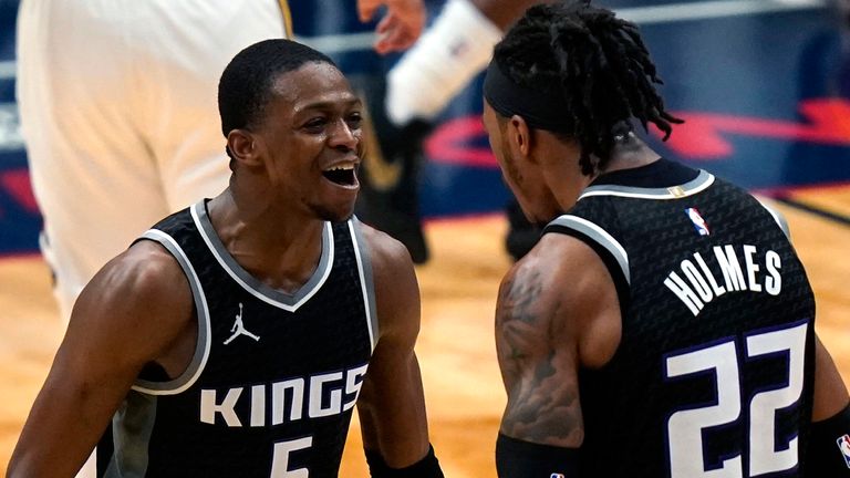 Sacramento Kings guard De&#39;Aaron Fox (5) celebrates with center Richaun Holmes (22) after scoring a basket late in the second half of an NBA basketball game against the New Orleans Pelicans in New Orleans, Monday, Feb. 1, 2021.