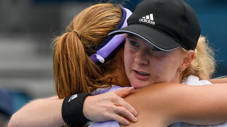Britain's Francesca Jones, right, embraces Argentina's Nadia Podorska, left, following their match at a tuneup tournament ahead of the Australian Open tennis championships in Melbourne, Australia, Monday, Feb. 1, 2021. (AP Photo/Andrew Brownbill)