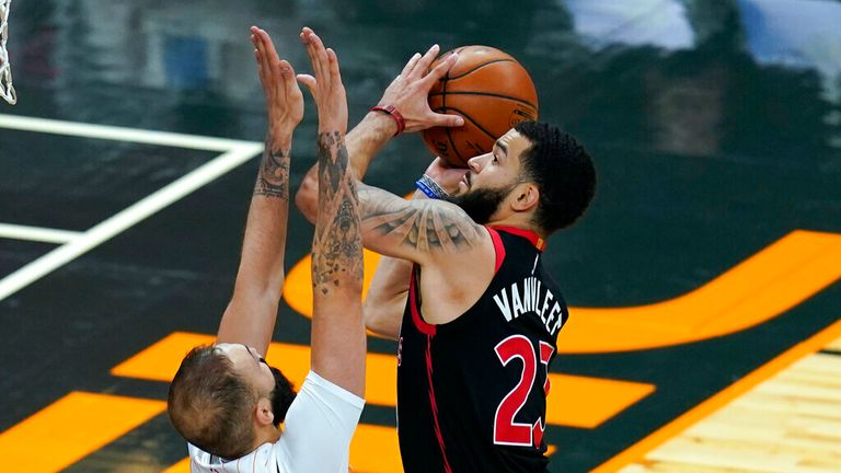 AP - Toronto Raptors guard Fred VanVleet, right, goes up against Orlando Magic guard Evan Fournier