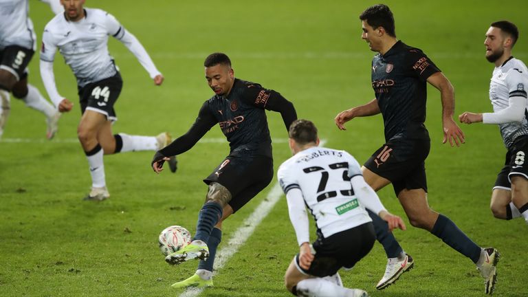 Gabriel Jesus shoots to score Manchester City's third goal in the FA Cup tie at Swansea