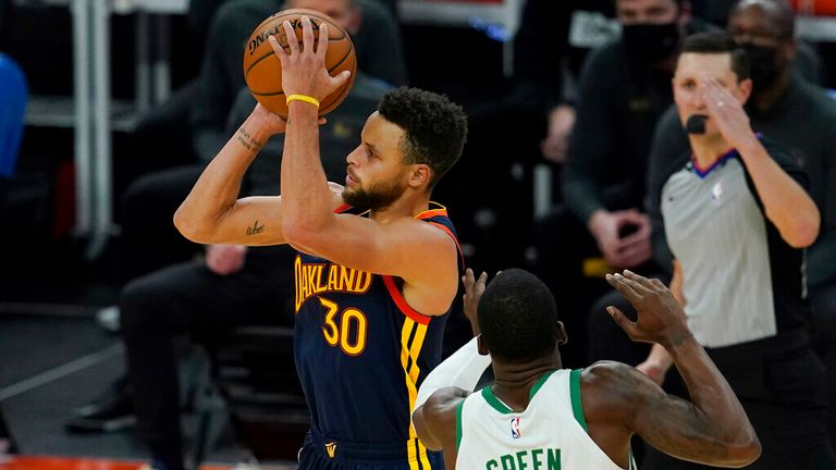 AP - Golden State Warriors guard Stephen Curry (30) shoots a 3-point basket next to Boston Celtics guard Javonte Green
