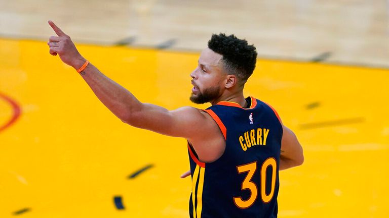 AP - Golden State Warriors guard Stephen Curry (30) celebrates after shooting a 3-point basket