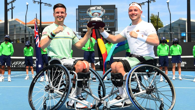 Gordon Reid of Great Britain and Alfie Hewett of Great Britain pose with the championship trophy after winning the Men's Wheelchair Doubles Final against Stephane Houdet of France and Nicolas Peifer of France during day nine of the 2021 Australian Open at Melbourne Park on February 16, 2021 in Melbourne, Australia. (Photo by Quinn Rooney/Getty Images)