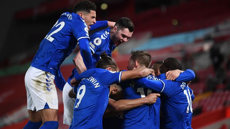 Everton players celebrate after Gylfi Sigurdsson puts them 2-0 up at Anfield